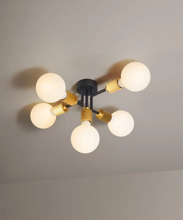 black and gold semi-flush ceiling light on a neutral ceiling