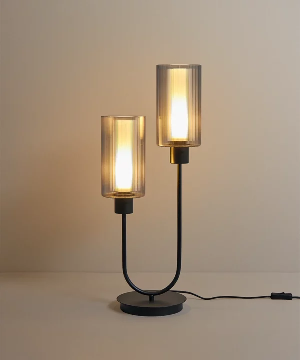 black table lamp with two bulbs in ribbed glass shades