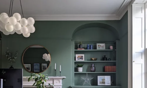 sage green home office with soft lighting
