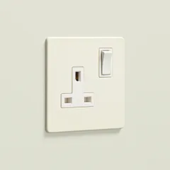 whipped cream single plug socket on a cream wall