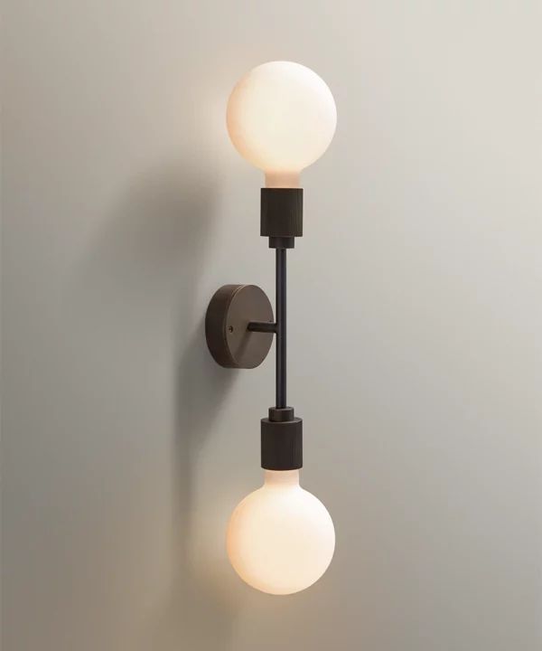 modern wall light with two opaque bulbs at the end of metal rods