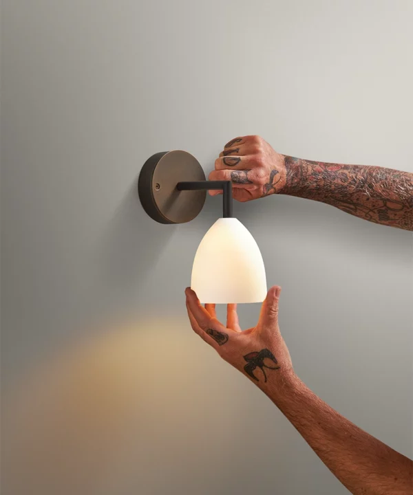 porcelain wall light with antique brass metal hardware