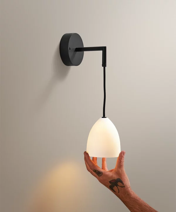 porcelain wall light in antique brass