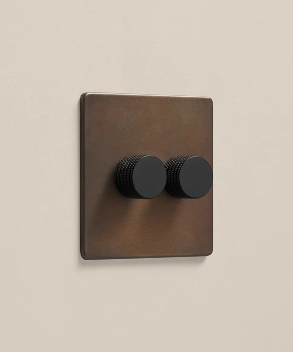 2 gang bronze double dimmer switch with two black knurled knobs