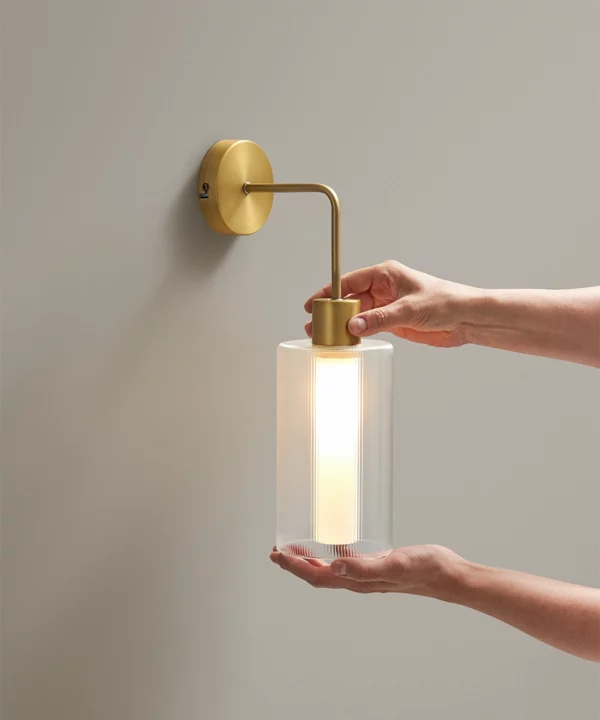 gold wall light with glass shade