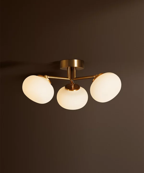 gold Waldorf semi-flush ceiling light with three opaque glass shades on metal arms