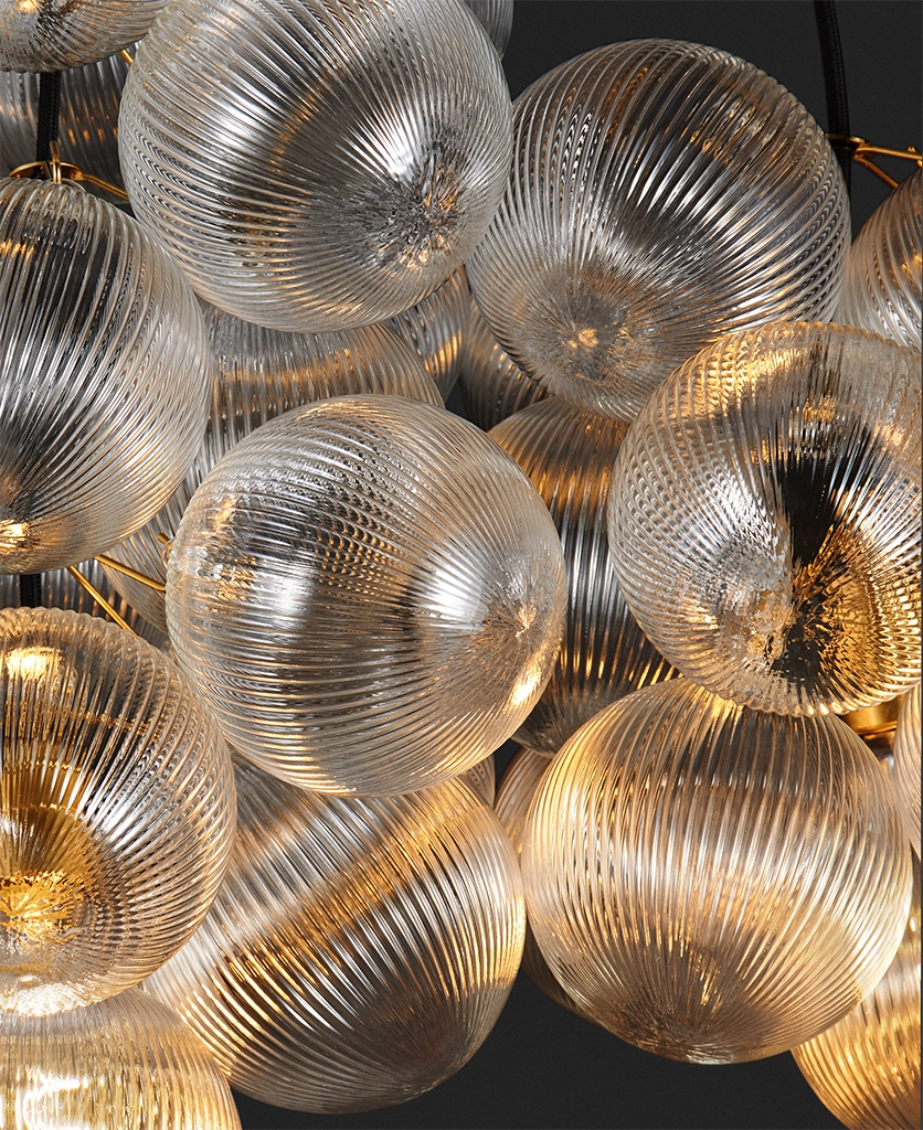 macro shot of ribbed baubles on a bubble light lit up