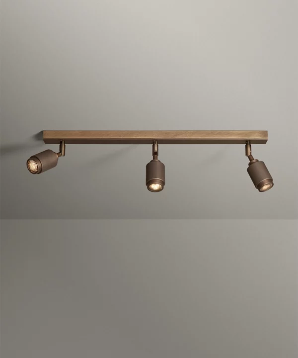 antique brass three spotlight bar with ribbed detail for designer flair
