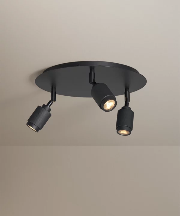 matt black flush ceiling spotlight with three lights each with ribbed detail