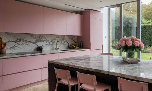 modern kitchen with pink units and marble worktops looking out over a lush garden