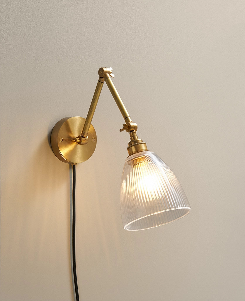 plug in industrial style wall lamp in brass with fluted glass shade