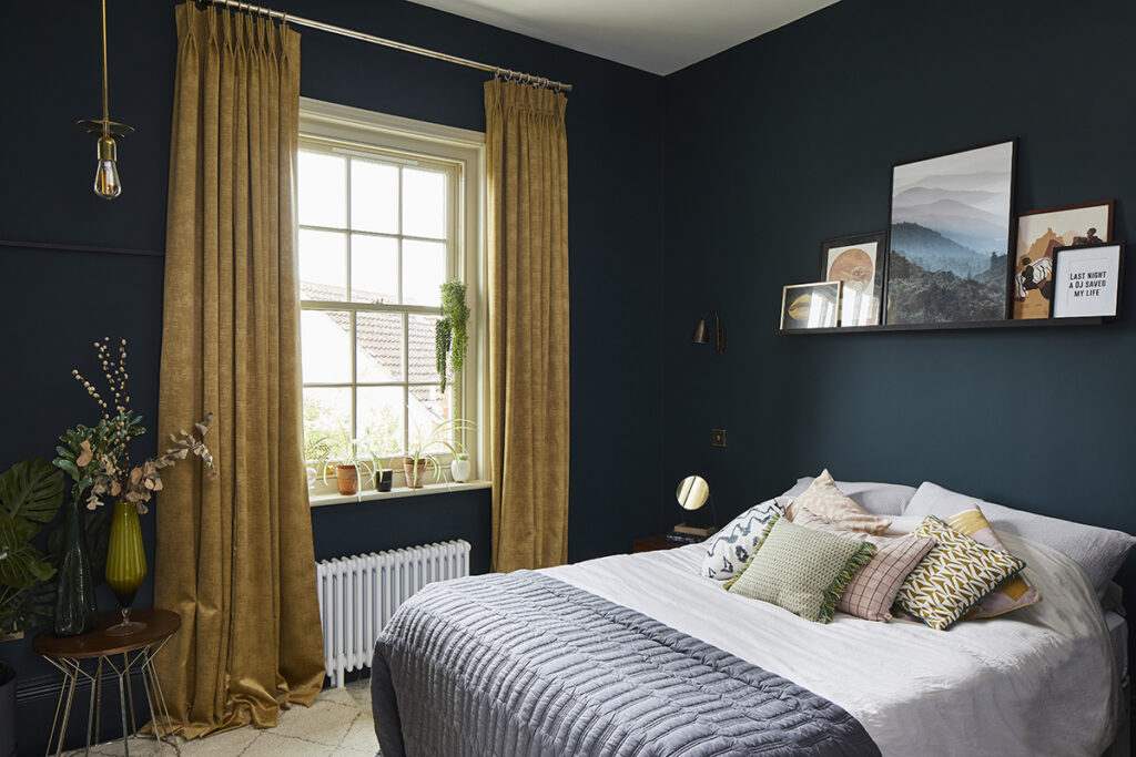 cosy dark trend bedroom with feature curtains