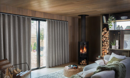 calm living room with floor to ceiling curtain wall