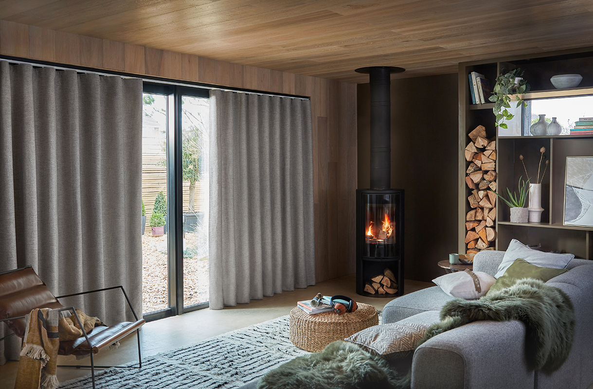 calm living room with floor to ceiling curtain wall