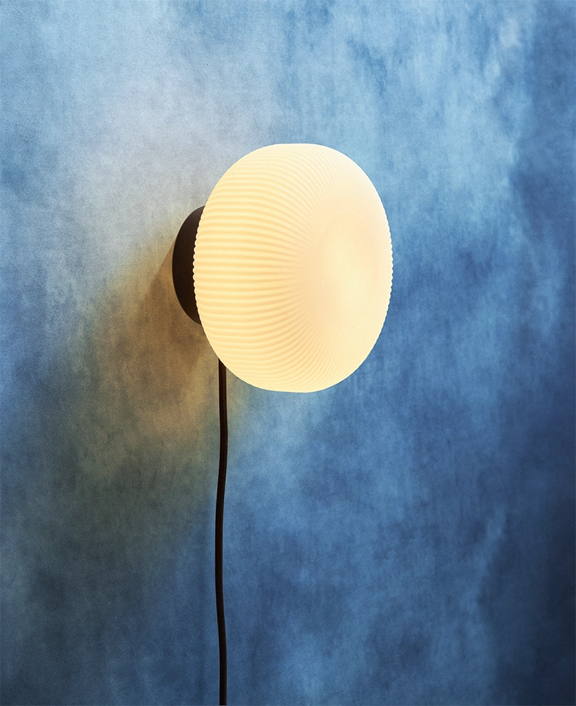 Black Nuvia frosted plug in wall light