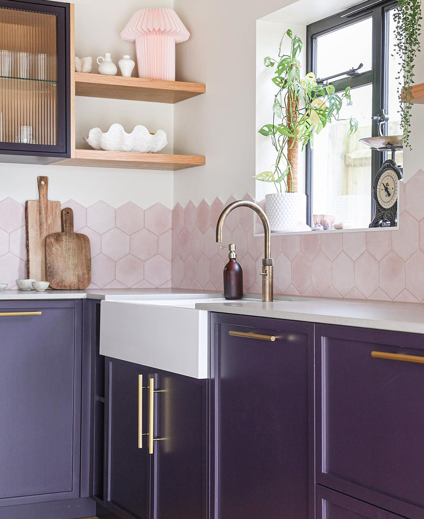 gold hive handles on deep purple kitchen cupboards