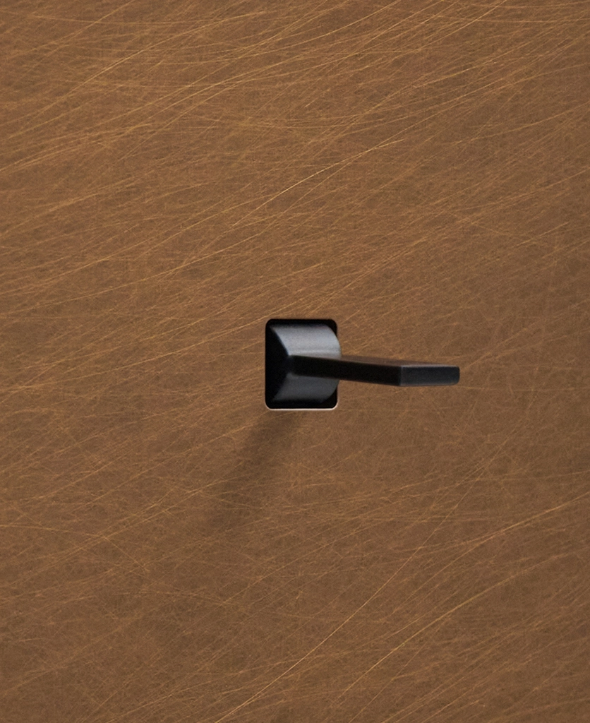 smart tapered toggle light switch close up, black toggle on antique brass plate